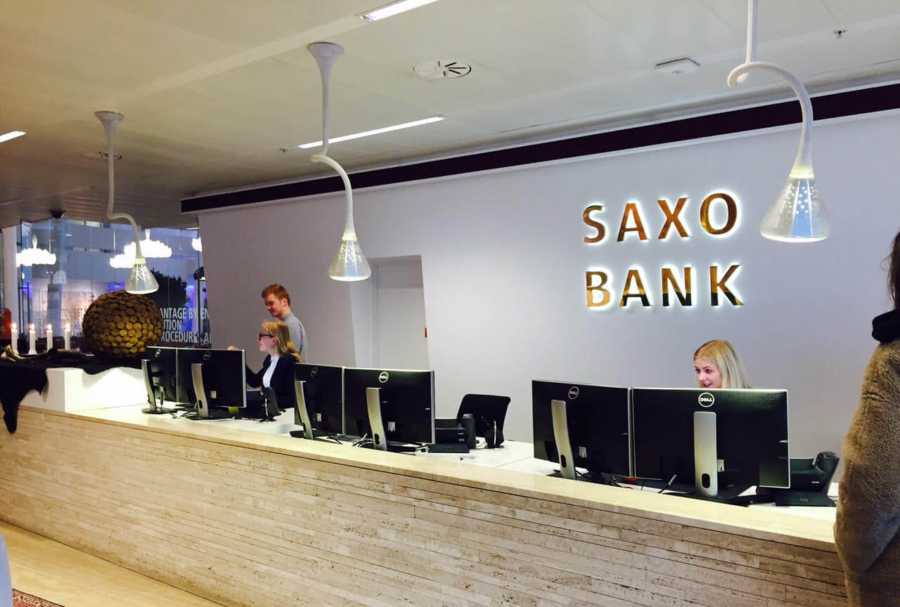 S&P Global Ratings has raised Saxo Bank's credit rating to 'A-', citing the Danish firm's efforts to enhance its resolvability and capital buffers in line with systemic institution rules.