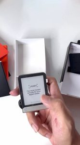 Ledger Flex powered on, held in hand